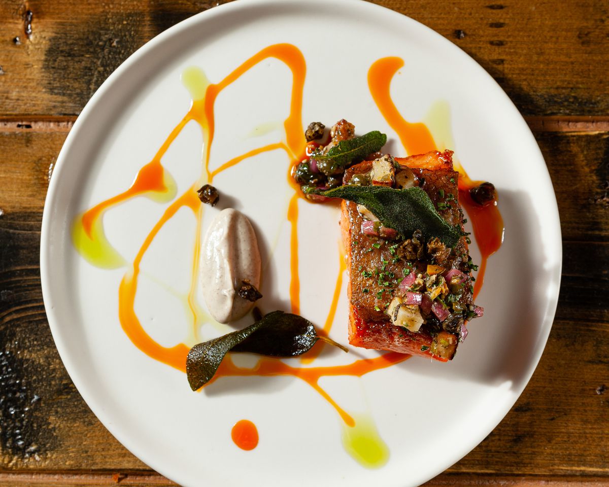 A colorfully sauced fish dish.