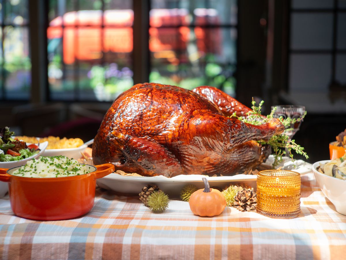 A smoked turkey on a Thanksgiving table.