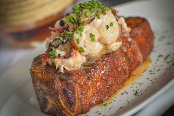 Steak topped with lobster.